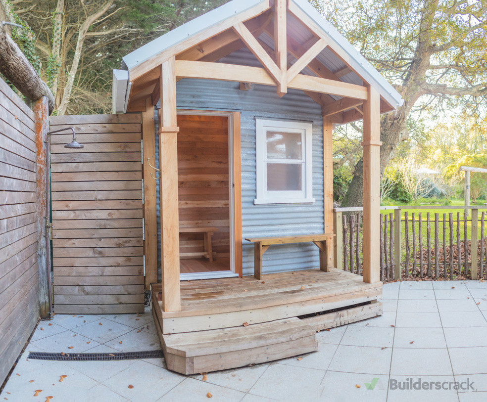 Custom built woodfire sauna, complete with outdoor shower, privacy screening, manuka fencing and honed terazzo patio