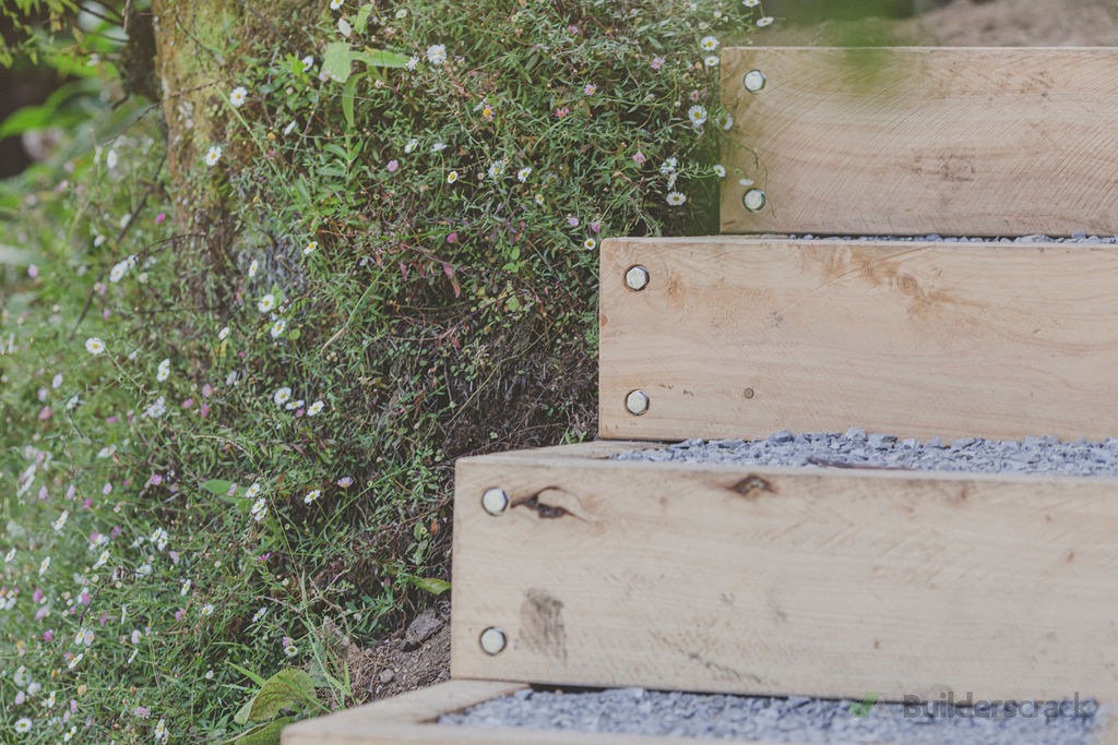 Simple macrocarpa box and pebble stairs with recessed coachscrews