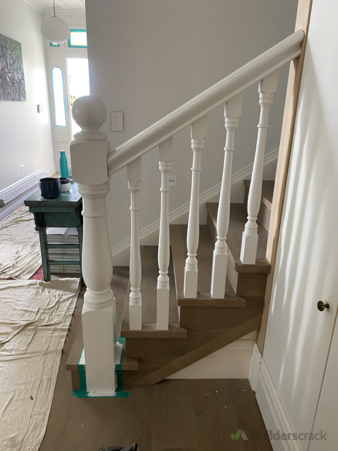 Balustrade being installed and Flooring overlay on stairs and