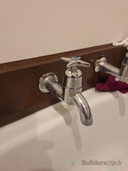 Dripping bathroom sink pipe and cold tap dripping ( 1014753