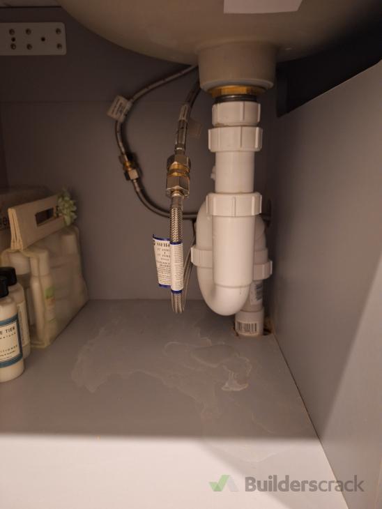 Dripping bathroom sink pipe and cold tap dripping ( 1014753