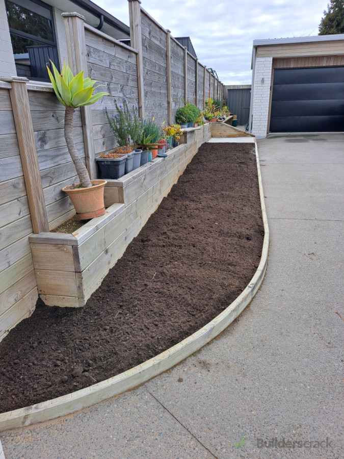 Dig out 300mm of clay . Installed 50/50 garden mix & topsoil