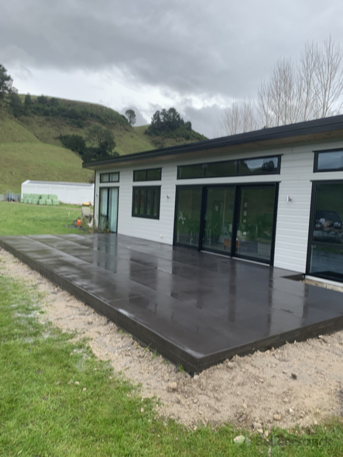 Black concrete patio with decorative cuts