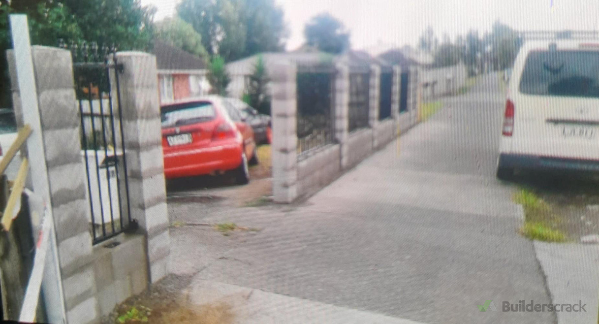 Brick and metal fence