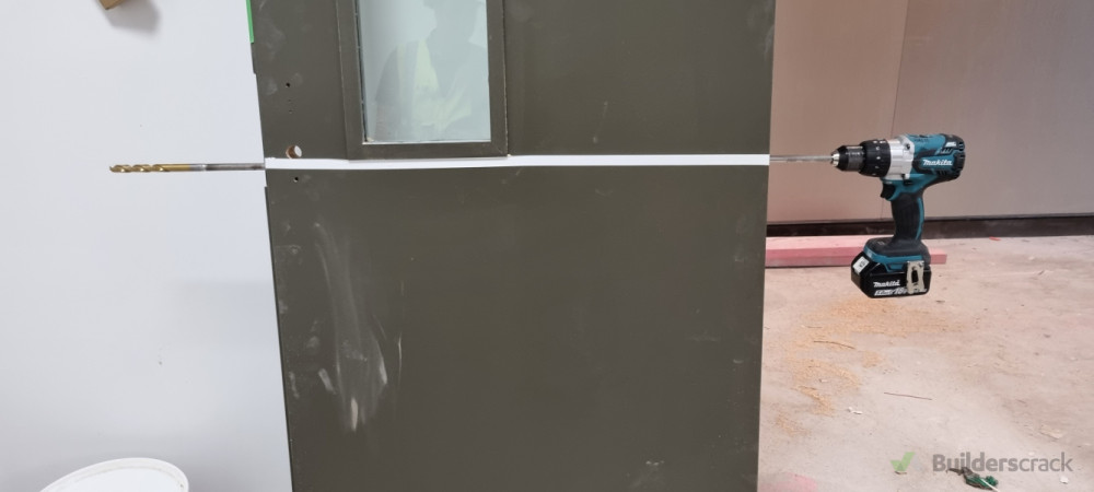 Preparing door for electronic look installation