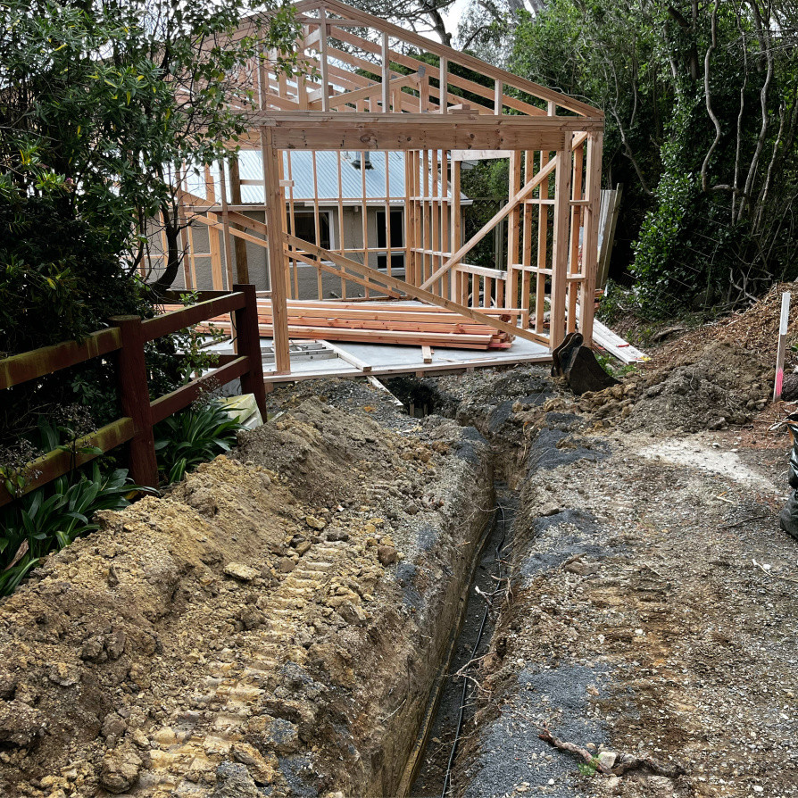 Halfway through drainage solutions, gravel driveway and concrete pad for a garage