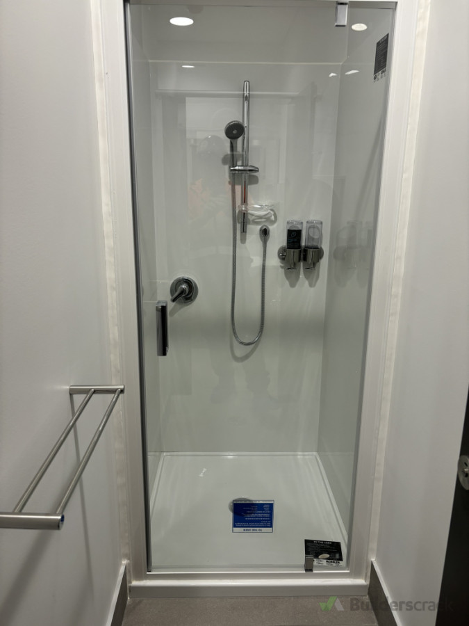 Shower installed with soap dispenser and towel rail