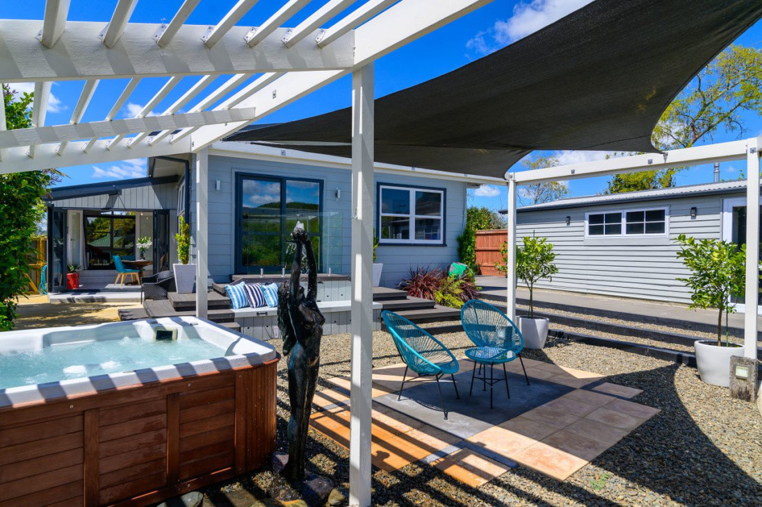 Pergola, conservatory and External split level layers of cosmetic stone, pavers, concrete, decking with lockable compartments