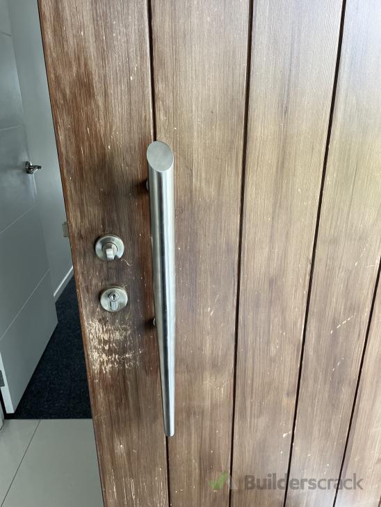 Change front door from traditional lock into a key pad lock and repair