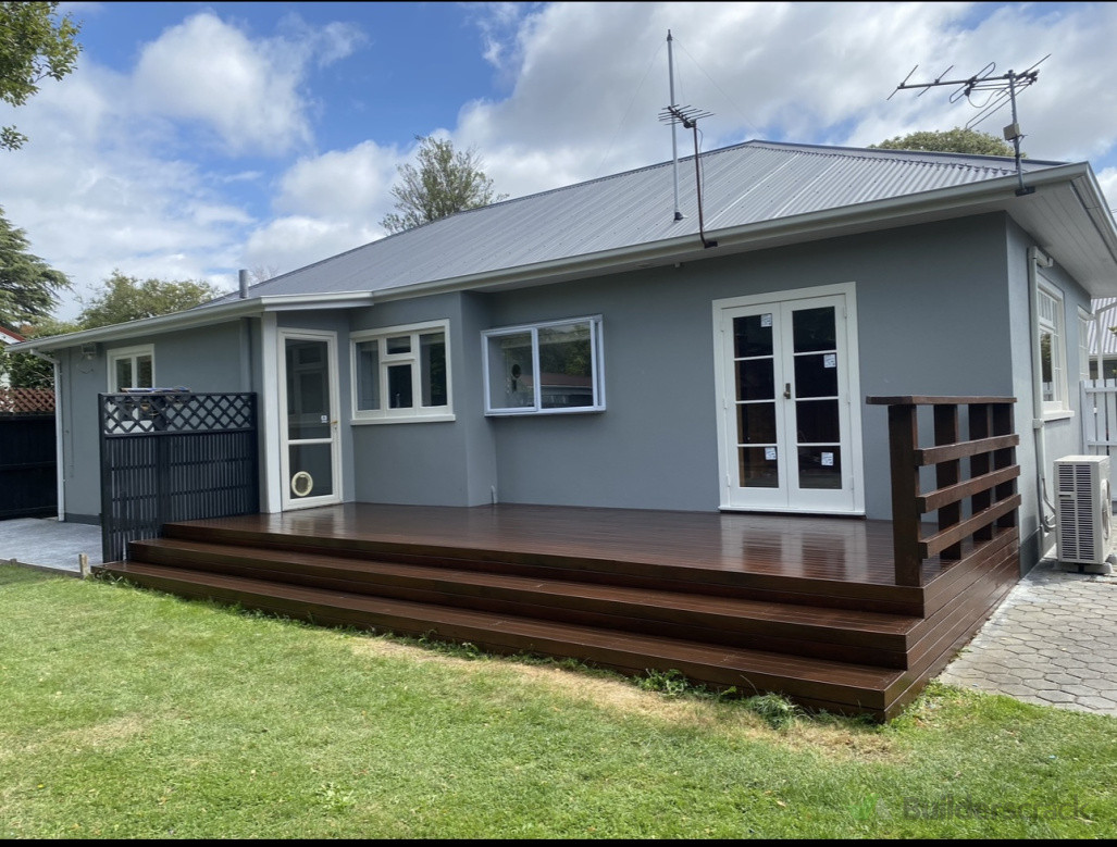 Exterior plaster painted and deck stained.