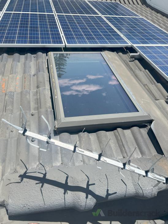 Fix leak around skylight concrete tile roof ( 1031258) Builderscrack