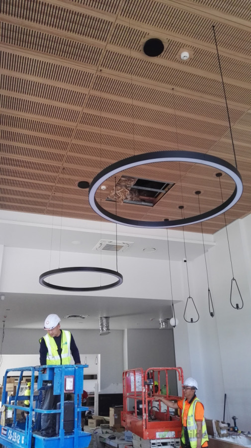 Large circular LED lights installed in a hotel reception area