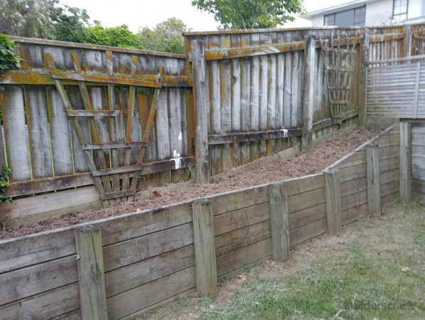 Weeded garden and turned over soil