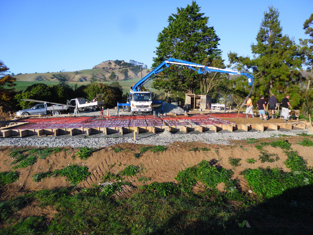 A new concrete pad is poured for one of our new builds.