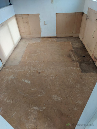 Old flooring removed, cabinetry removed