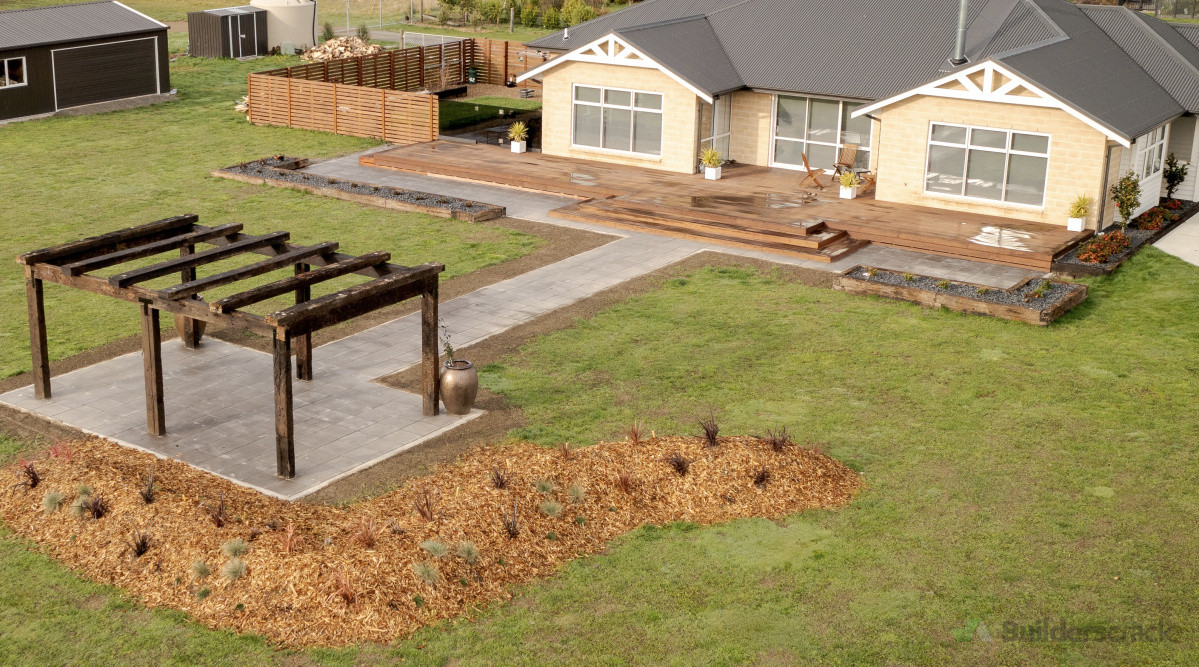 Kwila decking, paving and old bridge oak pergola in Woodend