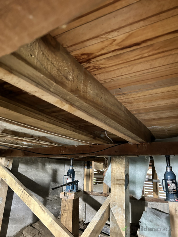 Rotten joist sistered with new board for strengthening