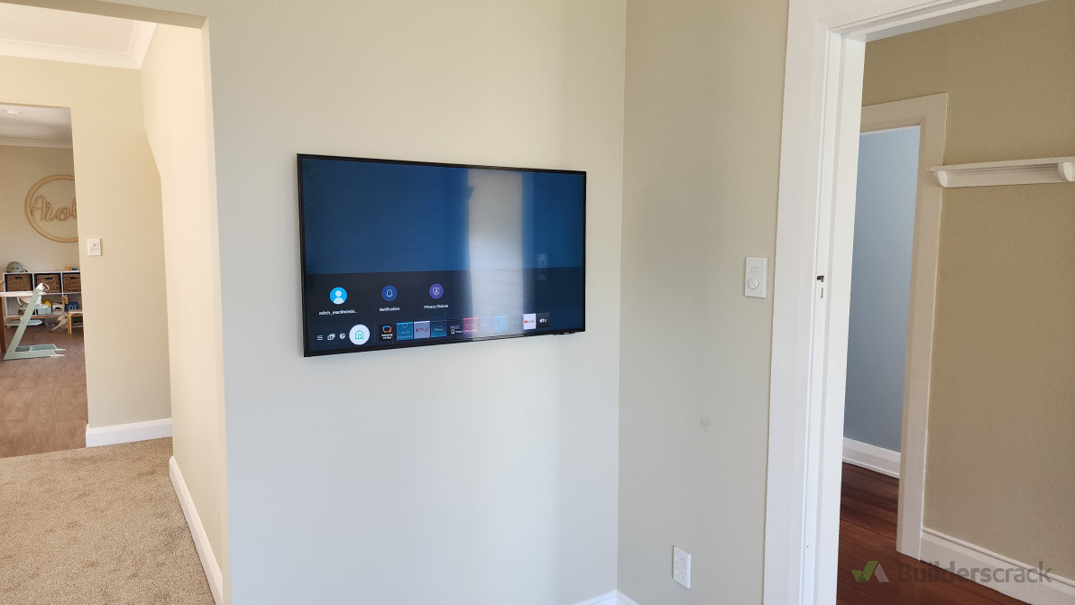 Wall mounted TV with concealed cabling.