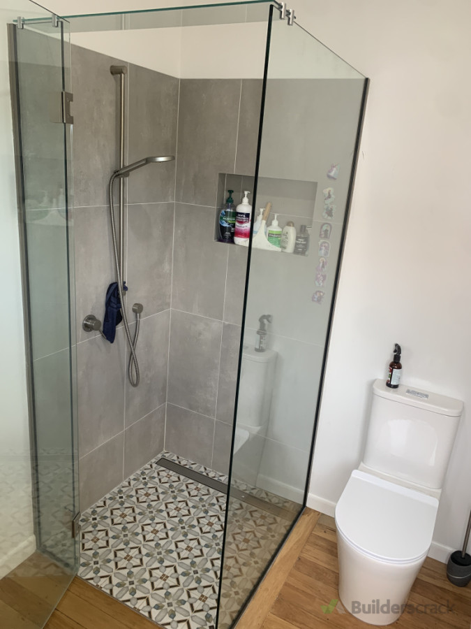 New shower with custom glass to show off high ceilings