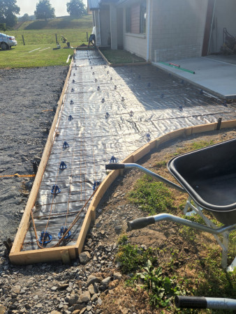 Plastic layer, mesh laid with d12 rod, on chairs and tied in ready for concrete