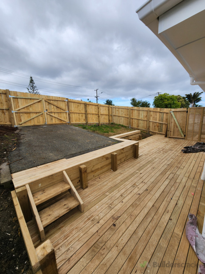 Timber deck, retaining wall and fence with gates.