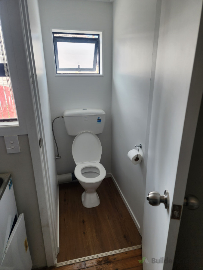 New toilet complete with frame ,window , floor and  walls