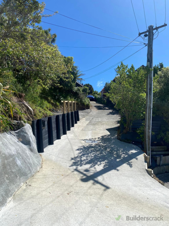A nice driveway entrance remodel seamlessly blending in with the surrounding landscape