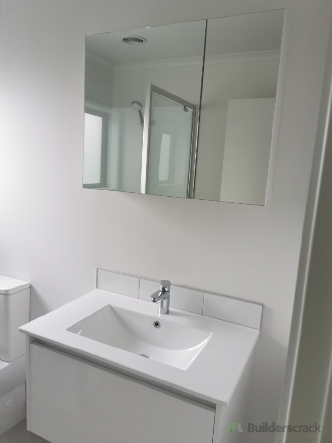 Mirror cabnate and vanity installed