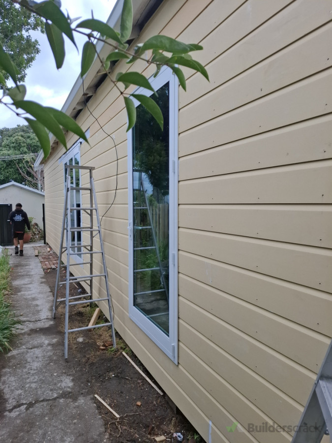 Shiplap cladding on 1920 house with modern bi fold doors.