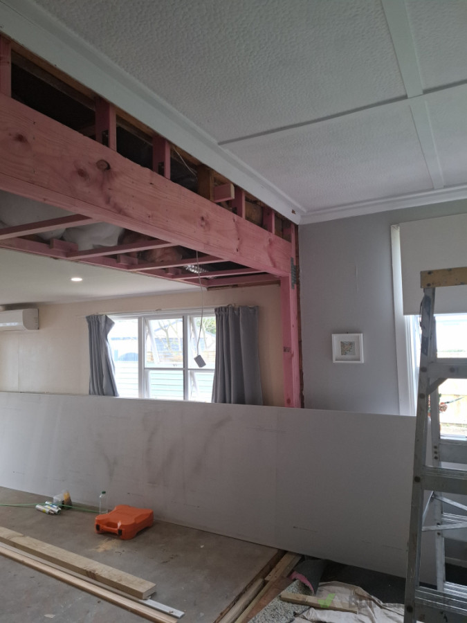 Remove load baring wall , install 290 beam.