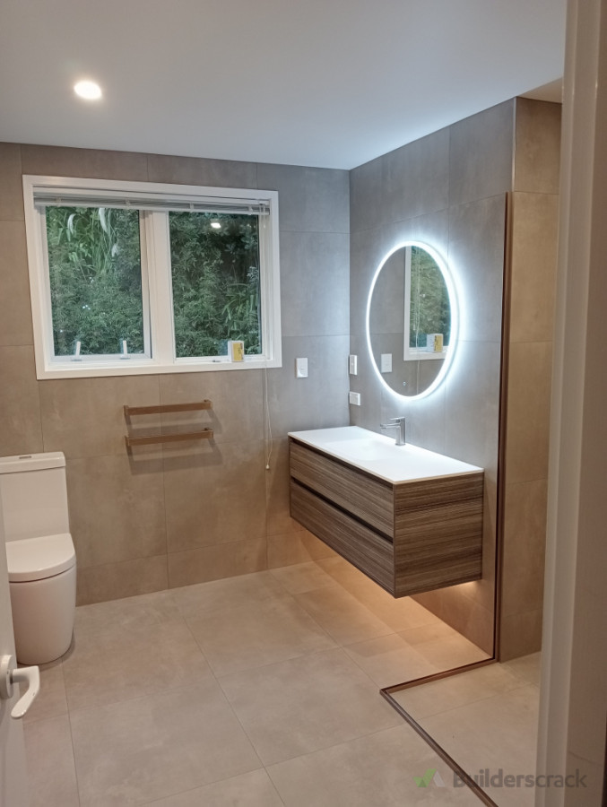 Backlit mirrors can add a feature to any bathroom renovation