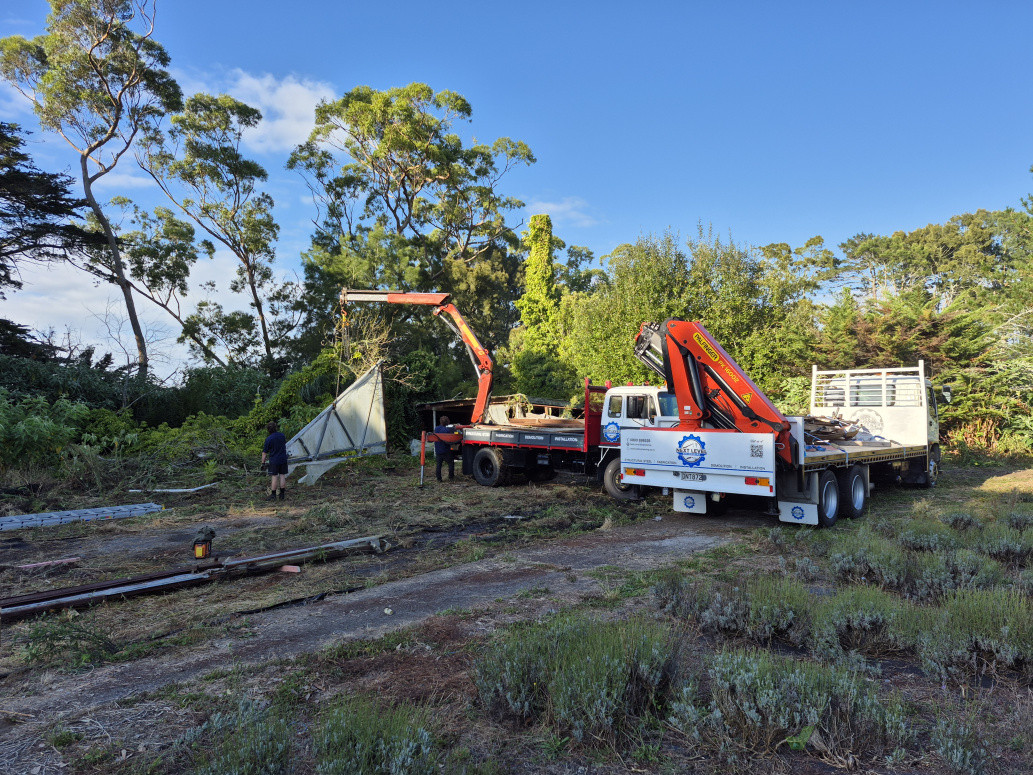 Two of our crane trucks working in tandem