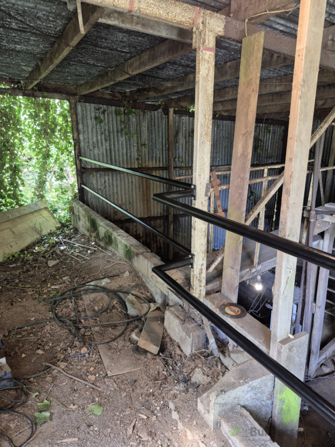 The new handrails we fabricated and installed to prevent a fall from and height and to ensure the property owner is legally compliant