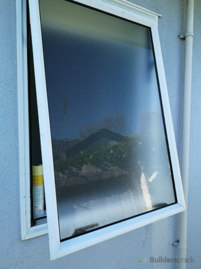Replace obscure glass on bathroom window.