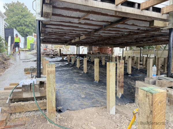 Piles cut to datum. Moisture barrier installation