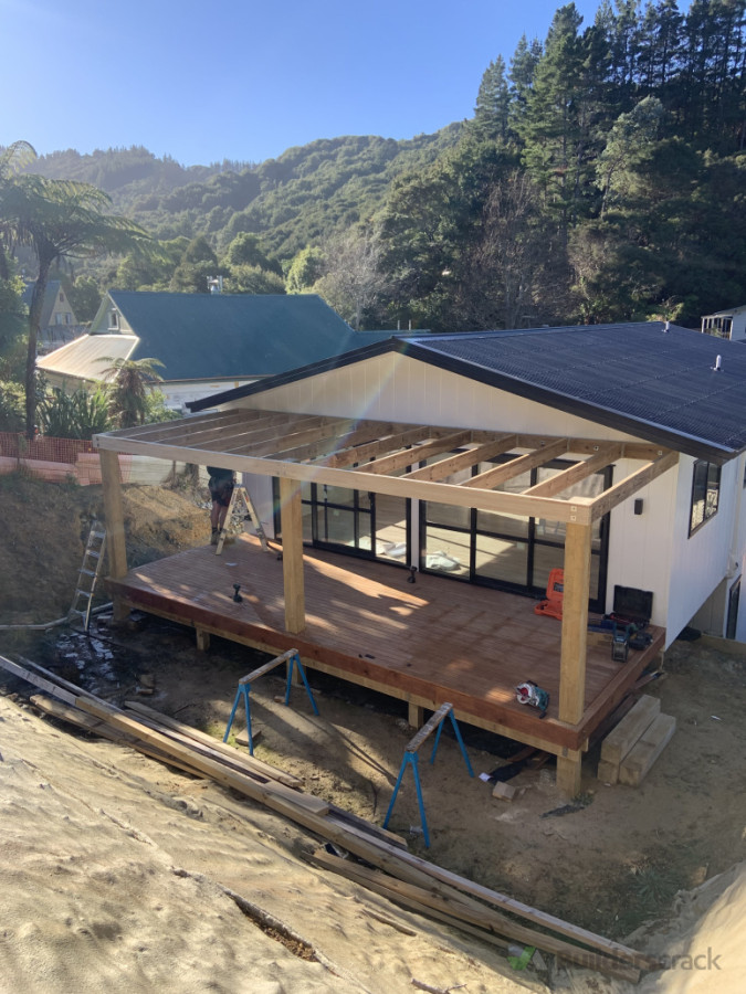 "A seamless addition to a modern home, this pergola enhances outdoor living while offering style and shade.