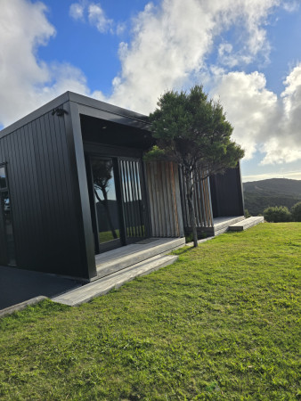 Aged hardwood decking and larch facade