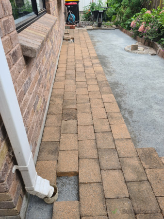 Reused old pavers around the back of the house