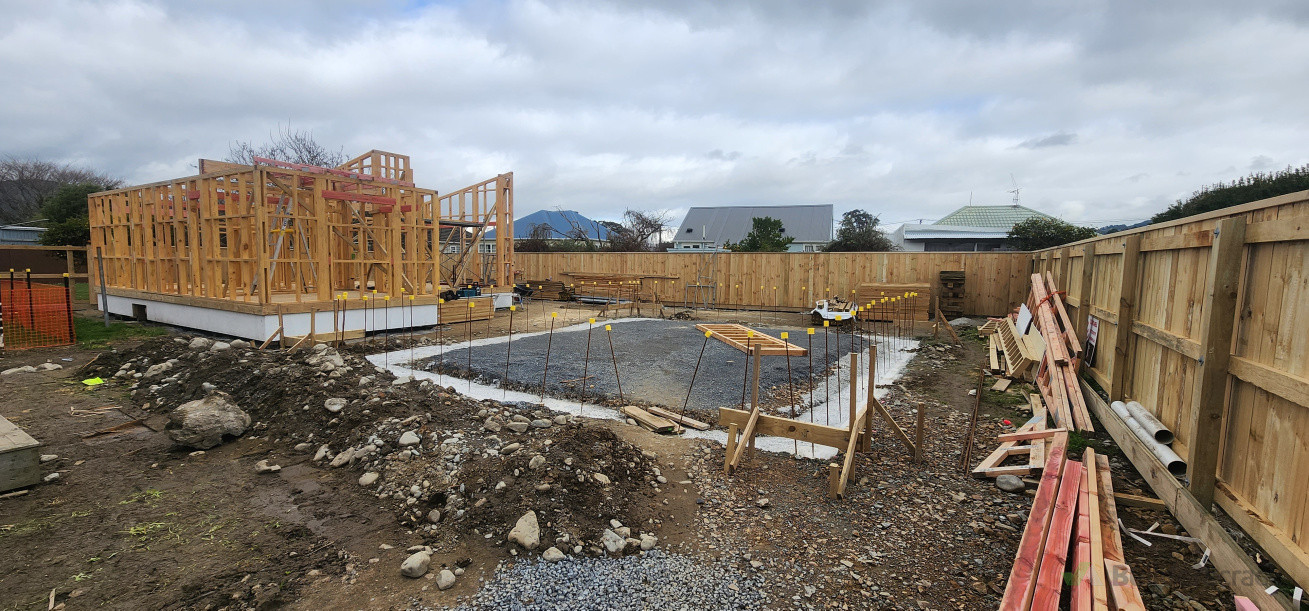 two different styles of homes , piled house and a slab house