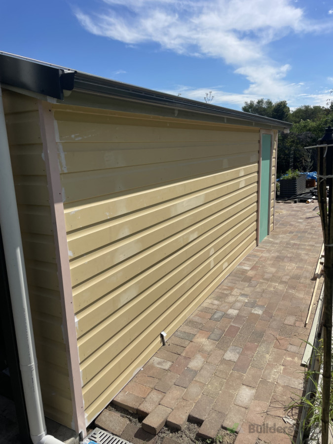 Rusticated timber weatherboard cladding