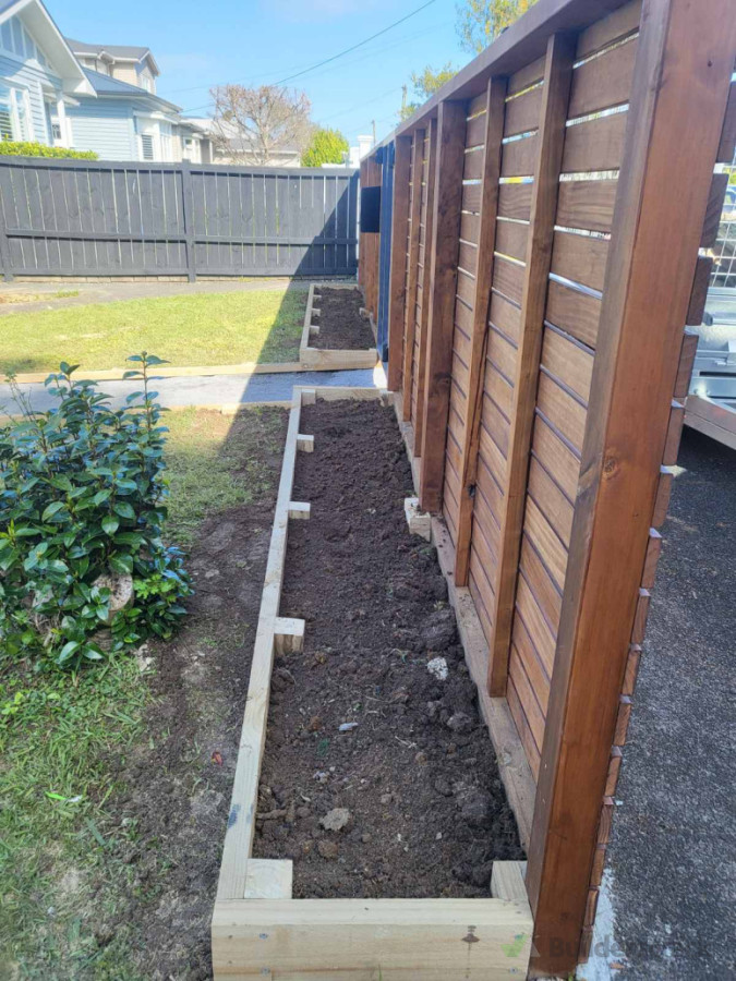 Planter boxes filled with soil