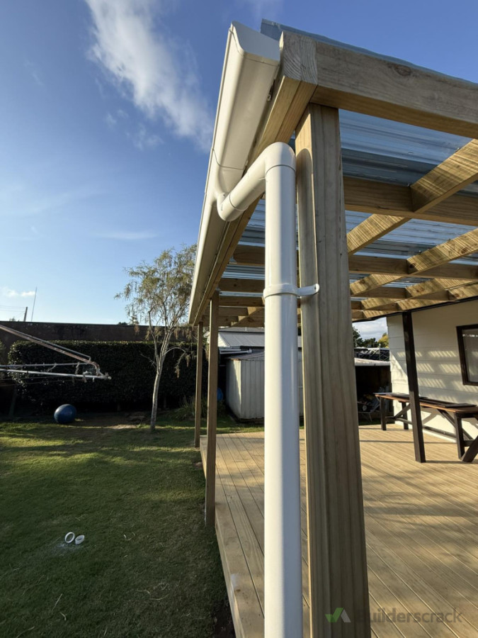 Down pipe attached to pergola spouting