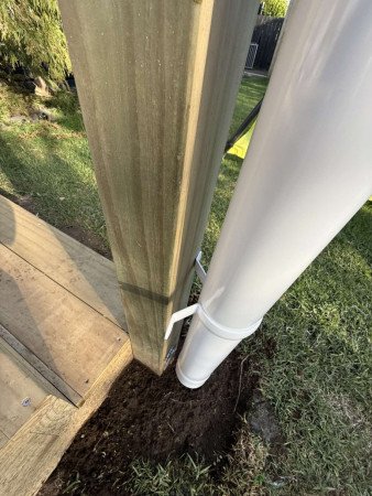 Down pipe attached to pergola spouting