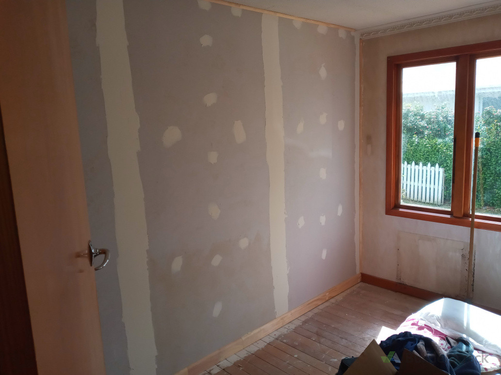 Build wall and install Gib to add another bedroom.