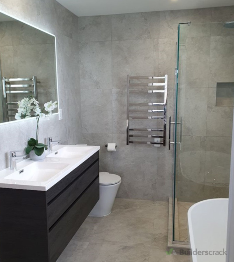 Modern bathroom featuring large-format porcelain tiles on walls and floors, installed by Direct Tiling