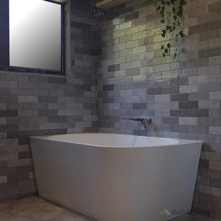 Bathroom with soft tones, grey subway tiles, and natural textures for a tranquil atmosphere, by Direct Tiling