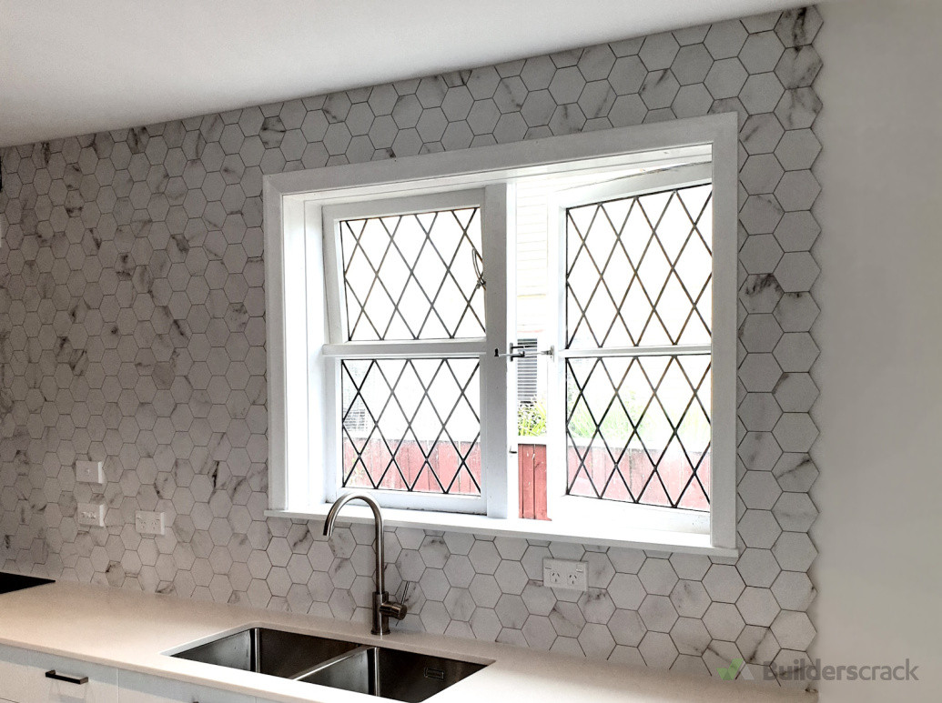 Stunning large marble hexagon mosaic tiles adding luxury and texture to a kitchen splashback, designed by Direct Tiling