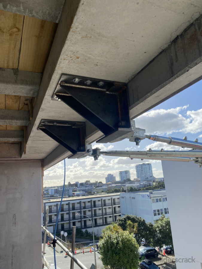 Structural brackets for construction hoist installation.