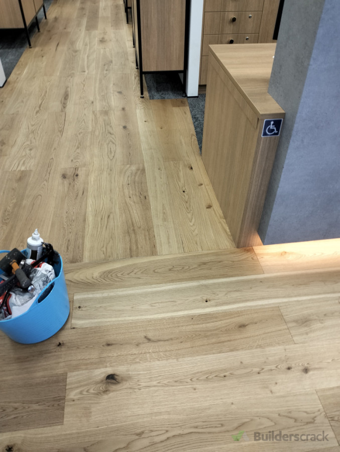 Hardwood flooring for barfoot and Thompson running different directions