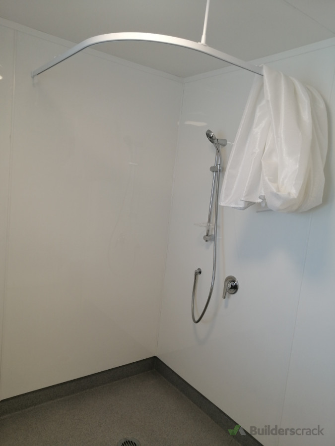 Accessible wet floor shower for individuals with disabilities